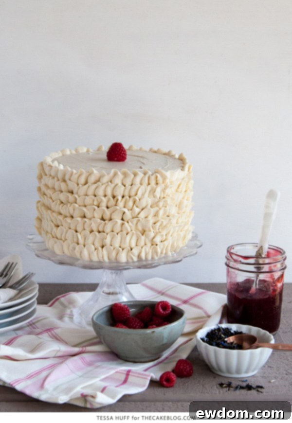 Raspberry Earl Grey Cake slices beautifully presented on a white plate