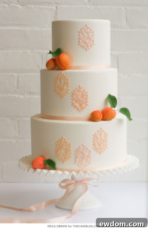 Stunning Peach String Art Cake by Erica O'Brien for TheCakeBlog.com, featuring modern geometric royal icing patterns.
