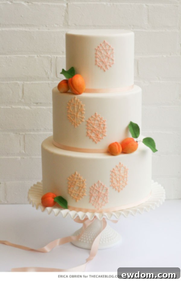 Preparation phase for the peach string art cake, showing a pristine white fondant base ready for decoration.