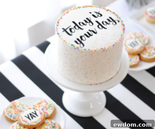 A beautifully decorated Graduation Party Dessert table, featuring a DIY sprinkle cake with easy edible writing, surrounded by other celebratory treats.