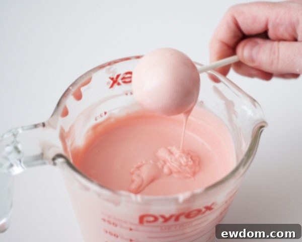 Place dipped large cake pops on a tray to set.