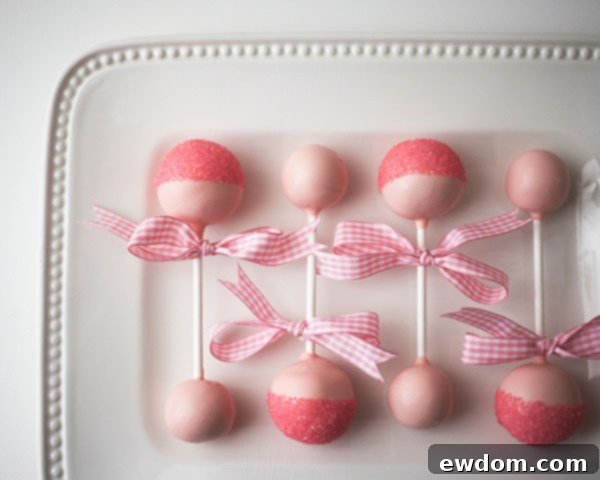 Beautifully decorated DIY Baby Rattle Cake Pops, perfect for baby showers.