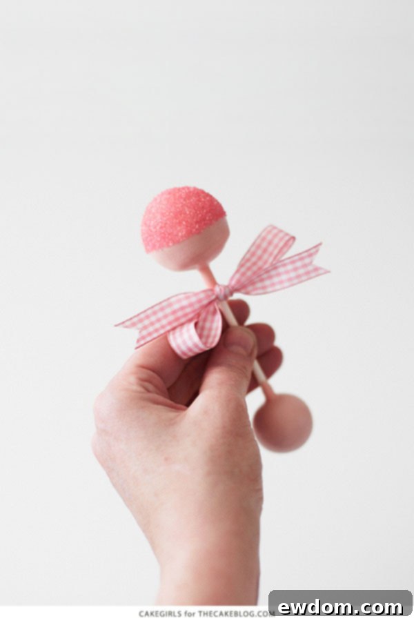 DIY Baby Rattle Cake Pops, perfect for baby showers | by Cakegirls for TheCakeBlog.com