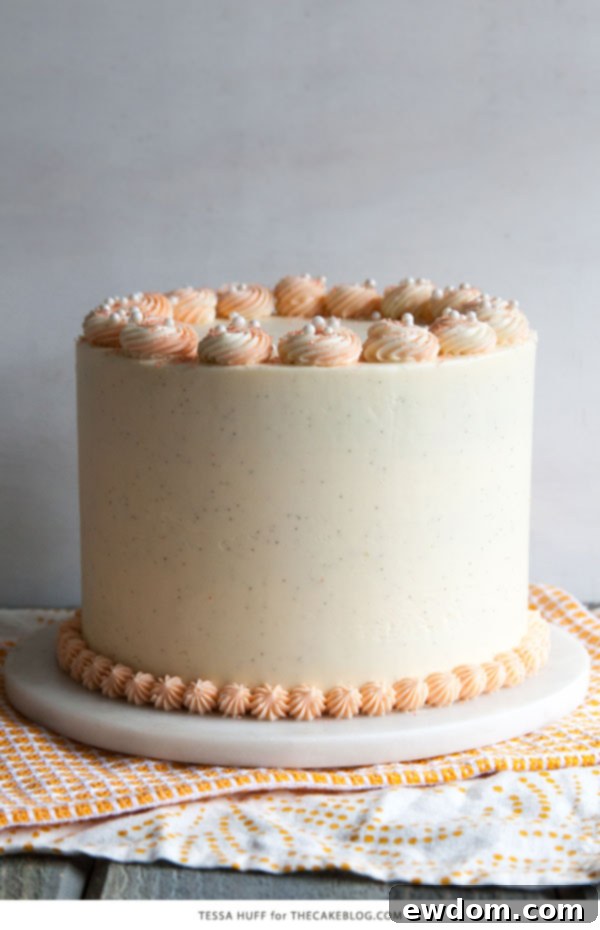 Stunning Orange Creamsicle Layer Cake, a refreshing summer dessert