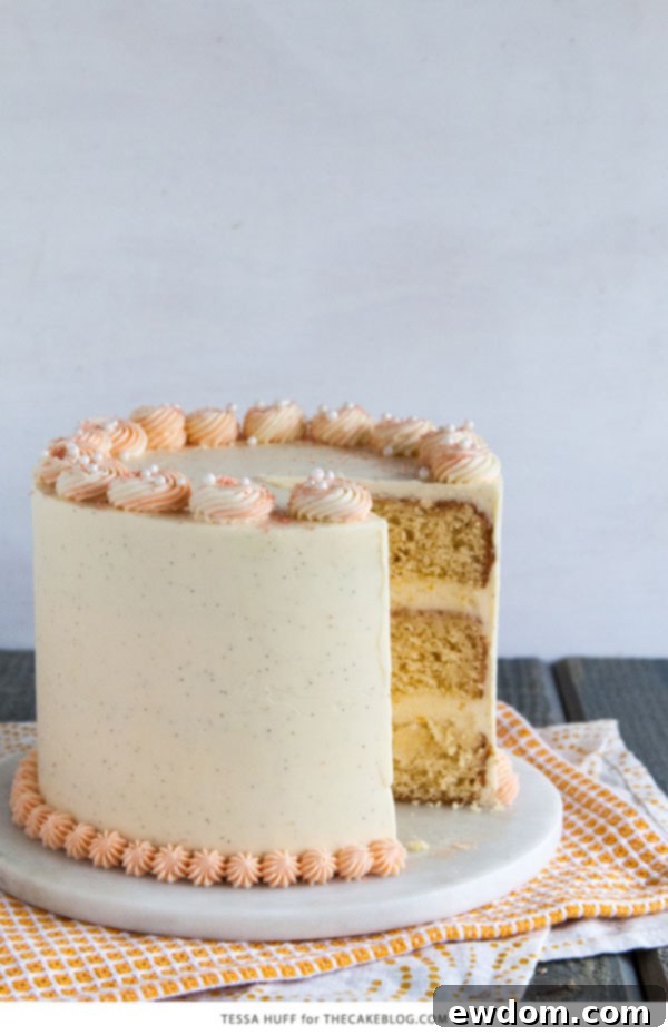 Top-down view of the decorated Orange Creamsicle Cake with sugar pearls