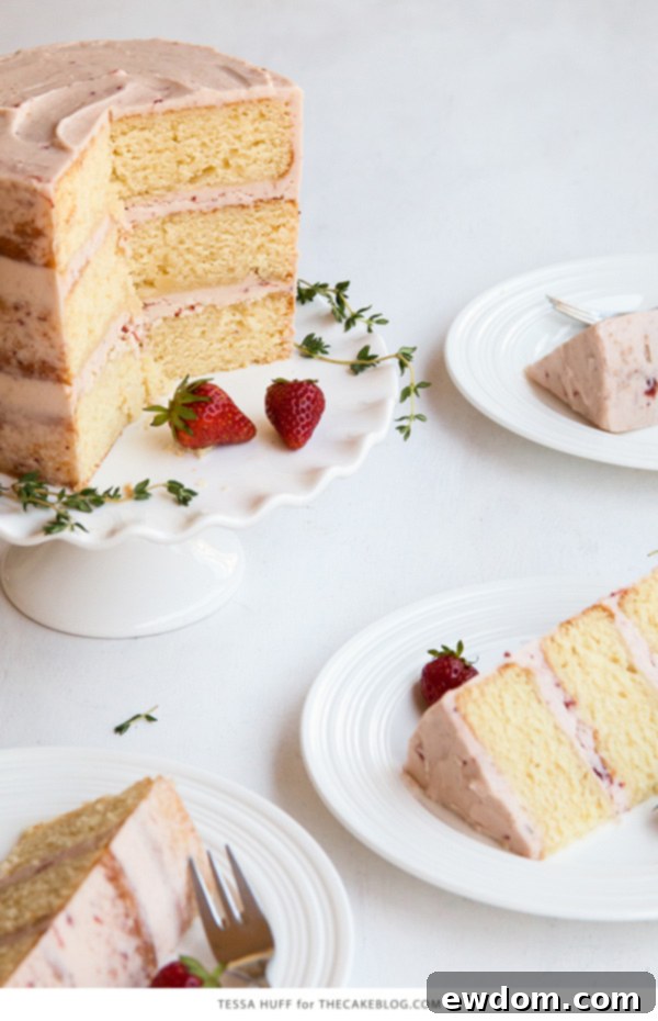 Thyme-Infused Strawberry Bliss 5 Strawberry Thyme Cake slice revealing layers of lemon ricotta cake and cheesecake filling