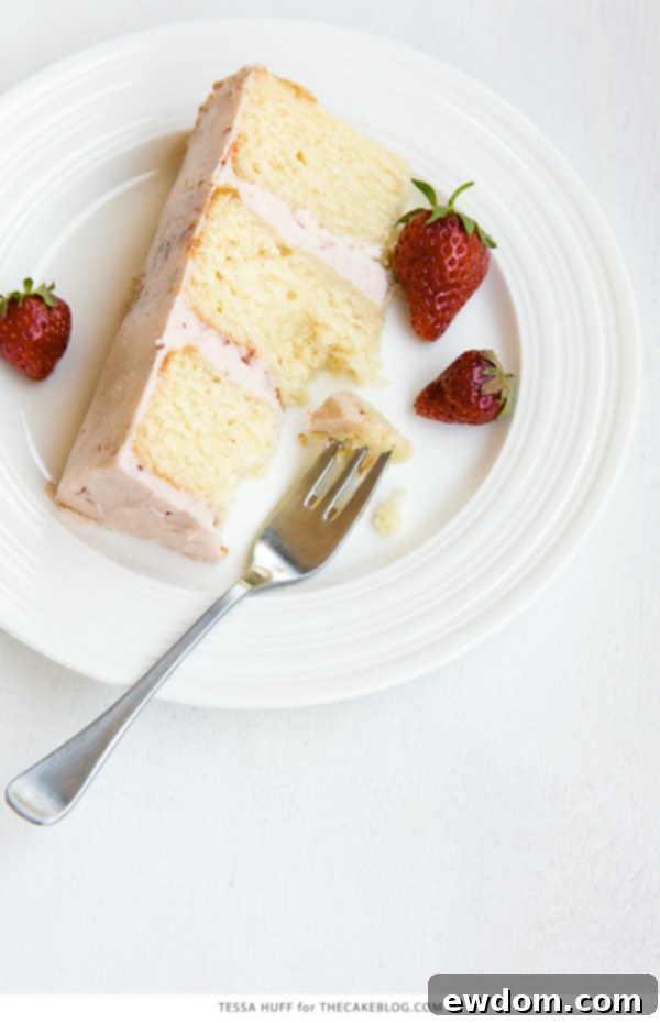 Thyme-Infused Strawberry Bliss 6 Close-up of a Strawberry Thyme Cake with fresh thyme sprigs and berries as garnish