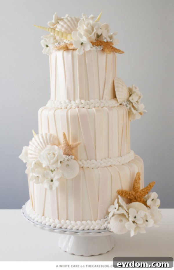 White-on-white textured nautical cake with seashell clusters by A White Cake