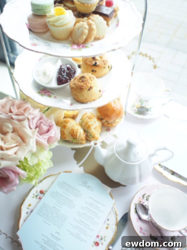 An elegant afternoon tea setting at Butter Bakery, featuring a selection of sandwiches, scones, and sweet treats served with custom-blended teas. A top high tea experience in Vancouver.