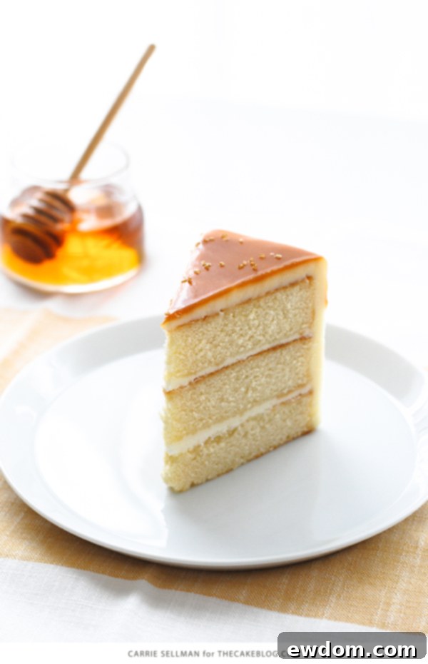 Top view of the Honey Butter Cake showcasing the stunning honey butterscotch glaze dripping down the sides, with optional gold sanding sugar.