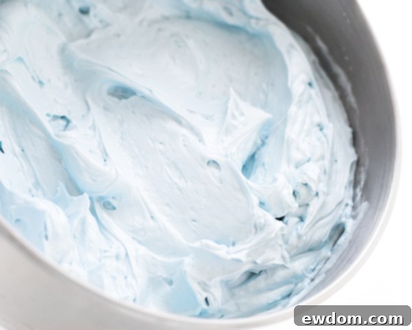 Coloring buttercream frosting a beautiful Cinderella blue