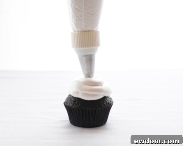 Touchdown Treat Cupcakes 9 NFL Game Day Cupcakes | chocolate cupcakes with fluffy marshmallow frosting and dipped in chocolate. Perfect for football tailgating and homegating.