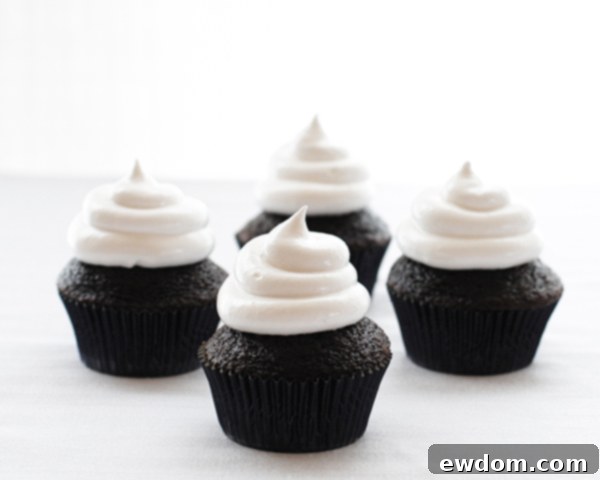 Touchdown Treat Cupcakes 10 NFL Game Day Cupcakes | chocolate cupcakes with fluffy marshmallow frosting and dipped in chocolate. Perfect for football tailgating and homegating.