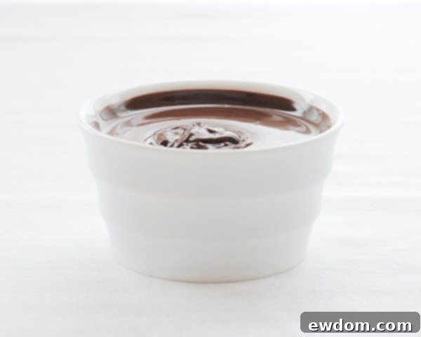 Touchdown Treat Cupcakes 11 NFL Game Day Cupcakes | chocolate cupcakes with fluffy marshmallow frosting and dipped in chocolate. Perfect for football tailgating and homegating.