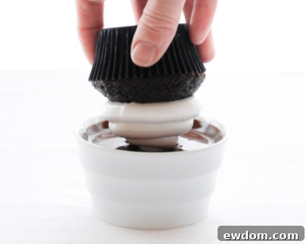 Touchdown Treat Cupcakes 13 NFL Game Day Cupcakes | chocolate cupcakes with fluffy marshmallow frosting and dipped in chocolate. Perfect for football tailgating and homegating.