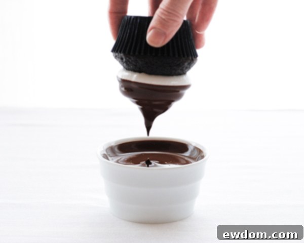 Touchdown Treat Cupcakes 15 NFL Game Day Cupcakes | chocolate cupcakes with fluffy marshmallow frosting and dipped in chocolate. Perfect for football tailgating and homegating.