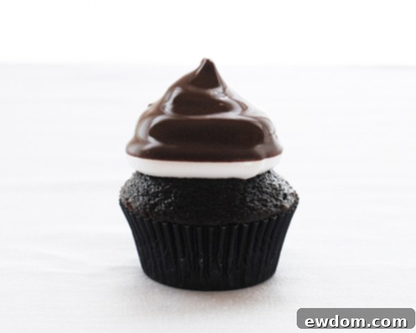 Touchdown Treat Cupcakes 16 NFL Game Day Cupcakes | chocolate cupcakes with fluffy marshmallow frosting and dipped in chocolate. Perfect for football tailgating and homegating.