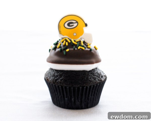 Touchdown Treat Cupcakes 18 NFL Game Day Cupcakes | chocolate cupcakes with fluffy marshmallow frosting and dipped in chocolate. Perfect for football tailgating and homegating.