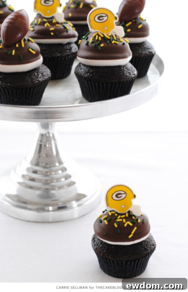 Touchdown Treat Cupcakes 20 NFL Game Day Cupcakes | chocolate cupcakes with fluffy marshmallow frosting and dipped in chocolate. Perfect for football tailgating and homegating.
