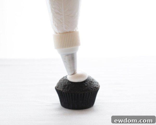 Touchdown Treat Cupcakes 8 NFL Game Day Cupcakes | chocolate cupcakes with fluffy marshmallow frosting and dipped in chocolate. Perfect for football tailgating and homegating.