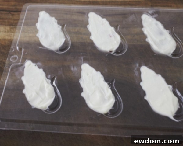 Creepy Mice Cakes! Learn how to make these spooky, red velvet filled, mice cakes -- a Halloween food sure to freak out your party guests | Cakegirls for TheCakeBlog.com