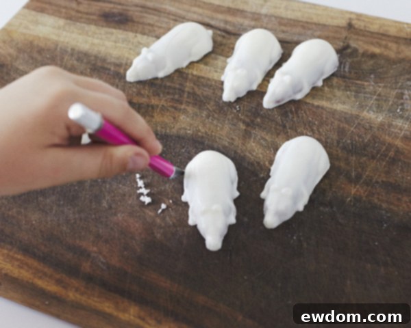 Creepy Mice Cakes! Learn how to make these spooky, red velvet filled, mice cakes -- a Halloween food sure to freak out your party guests | Cakegirls for TheCakeBlog.com