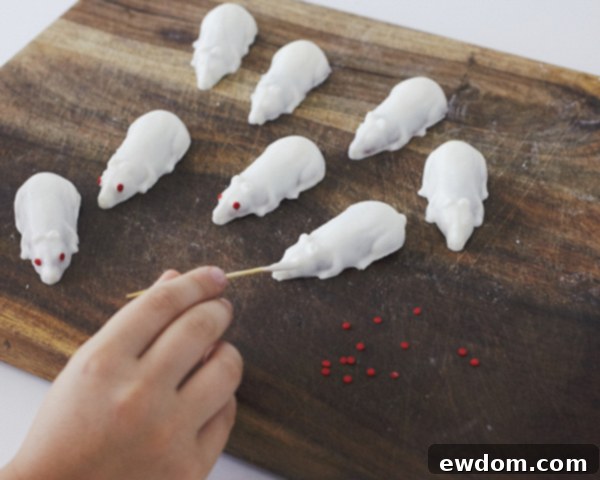 Creepy Mice Cakes! Learn how to make these spooky, red velvet filled, mice cakes -- a Halloween food sure to freak out your party guests | Cakegirls for TheCakeBlog.com