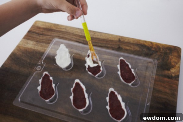 Creepy Mice Cakes! Learn how to make these spooky, red velvet filled, mice cakes -- a Halloween food sure to freak out your party guests | Cakegirls for TheCakeBlog.com