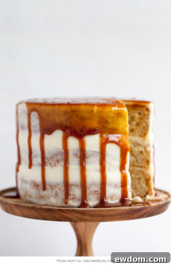 Close-up of a rustic Apple & Goat Cheese Cake with cinnamon caramel glaze