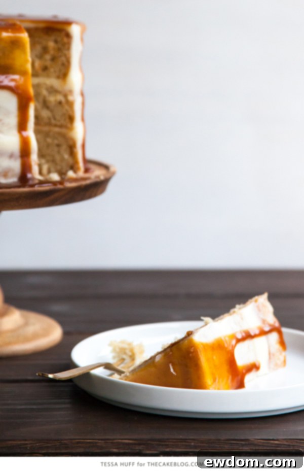Stacked Apple & Goat Cheese Cake layers with frosting and caramel drizzle