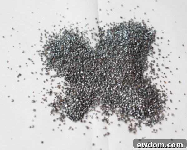 Fully covered black candy melt butterfly wings with silver sanding sugar