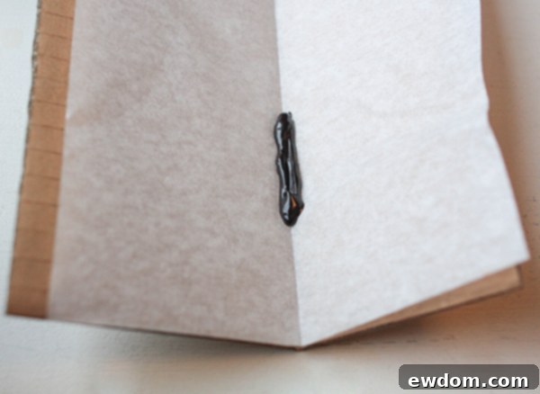 Piping a candy melt body and attaching butterfly wings in a V-shape