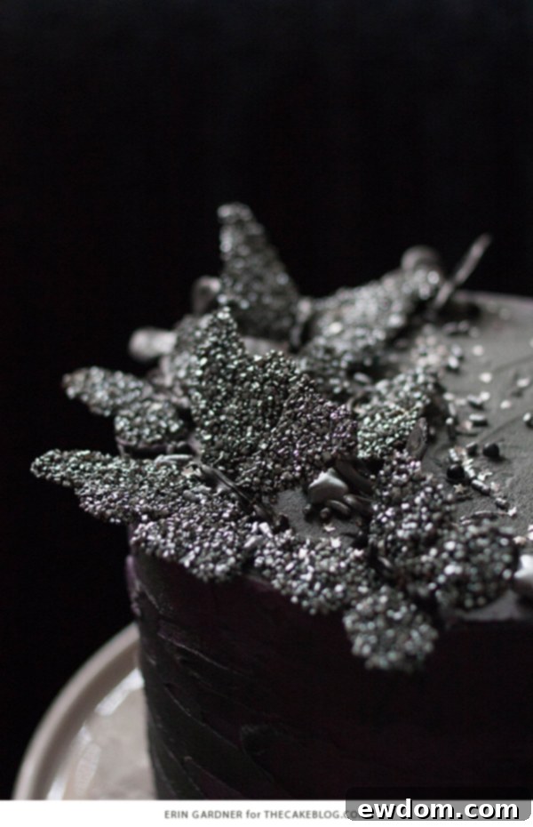 Detailed shot of a black edible butterfly on the Halloween cake