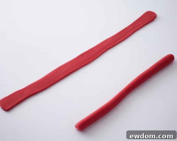 Flattening the fondant ropes with a rolling pin for the hat brim