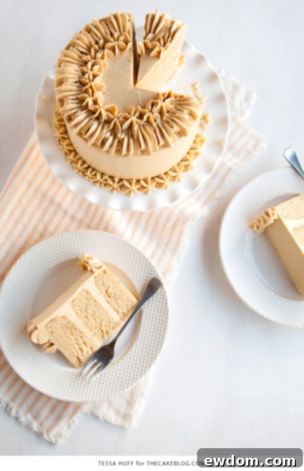 Close-up view of the intricate piping and smooth frosting on a Maple Pear Cake