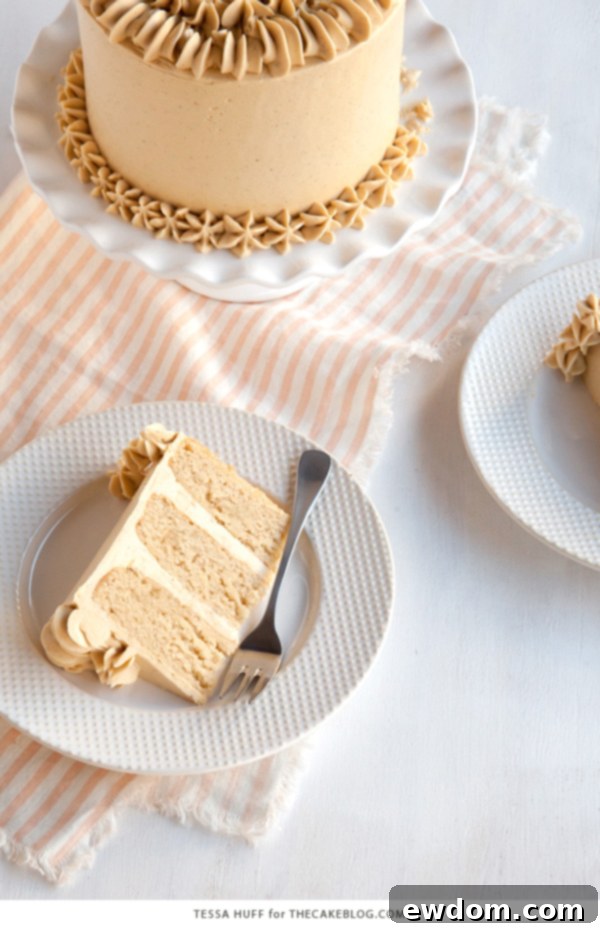 A stunning side view of the Maple Pear Cake, perfectly frosted and ready to serve