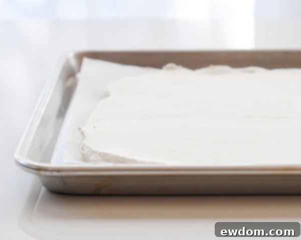 Cloud Cubes 7 Spreading Whipped Cream on Parchment Paper for Freezing