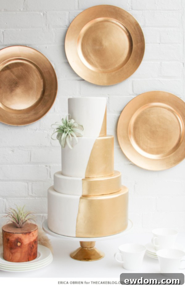 Stunning gold dipped wedding cake by Erica O'Brien for TheCakeBlog.com, showcasing modern elegance and unique design.