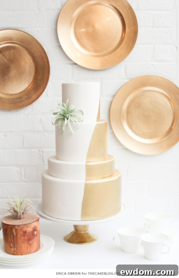 Final presentation of the elegant gold dipped wedding cake by Erica O'Brien, a perfect blend of modern and luxurious design.