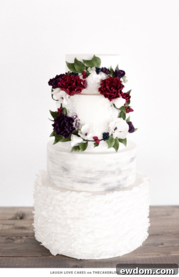 Whimsical Slate Grey Watercolor Winter Wedding Cake with Ruffles and Woodland Wreath by Laugh Love Cakes | TheCakeBlog.com