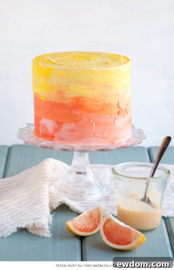 Pink Grapefruit Cake. A light olive oil cake filled with grapefruit curd and frosted with whipped vanilla buttercream - perfect for spring brunches, showers and birthdays | by Tessa Huff for TheCakeBlog.com