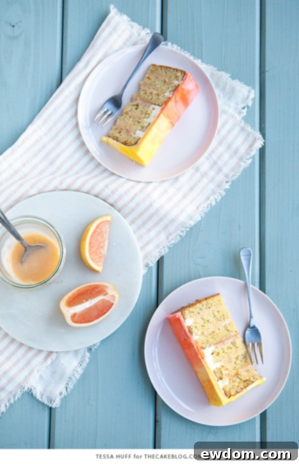 Pink Grapefruit Cake. A light olive oil cake filled with grapefruit curd and frosted with whipped vanilla buttercream - perfect for spring brunches, showers and birthdays | by Tessa Huff for TheCakeBlog.com