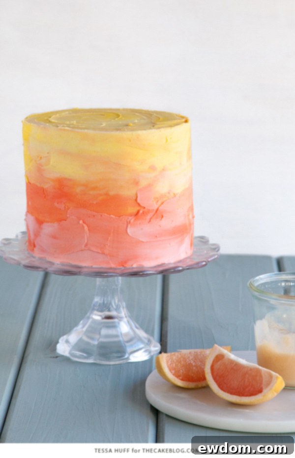 Pink Grapefruit Cake. A light olive oil cake filled with grapefruit curd and frosted with whipped vanilla buttercream - perfect for spring brunches, showers and birthdays | by Tessa Huff for TheCakeBlog.com