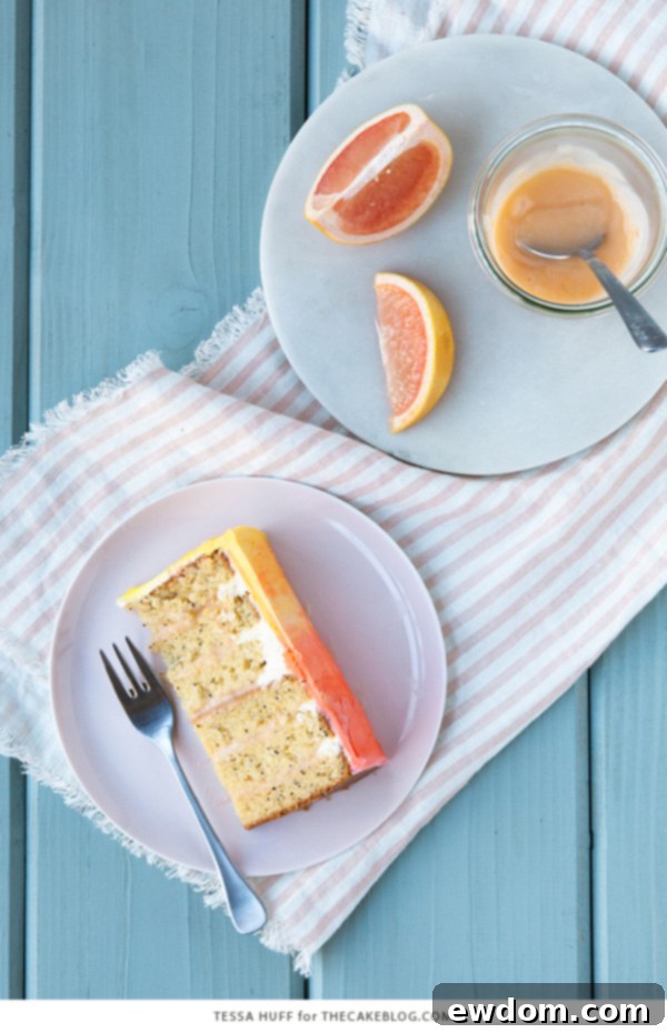 Pink Grapefruit Cake. A light olive oil cake filled with grapefruit curd and frosted with whipped vanilla buttercream - perfect for spring brunches, showers and birthdays | by Tessa Huff for TheCakeBlog.com