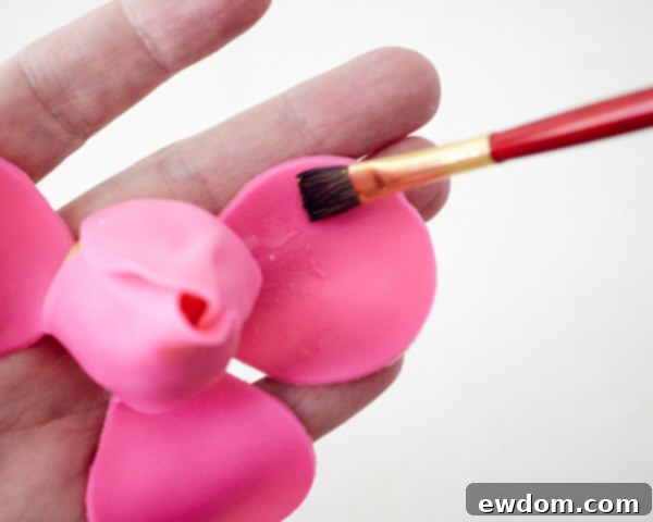 Blossom Cake Pops 16 Wrapping petal #3 around the rose bud, creating fuller layers.