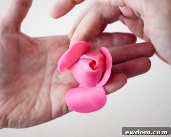 Blossom Cake Pops 18 Finished fondant rose cake pop, with delicately curled and flared petals.