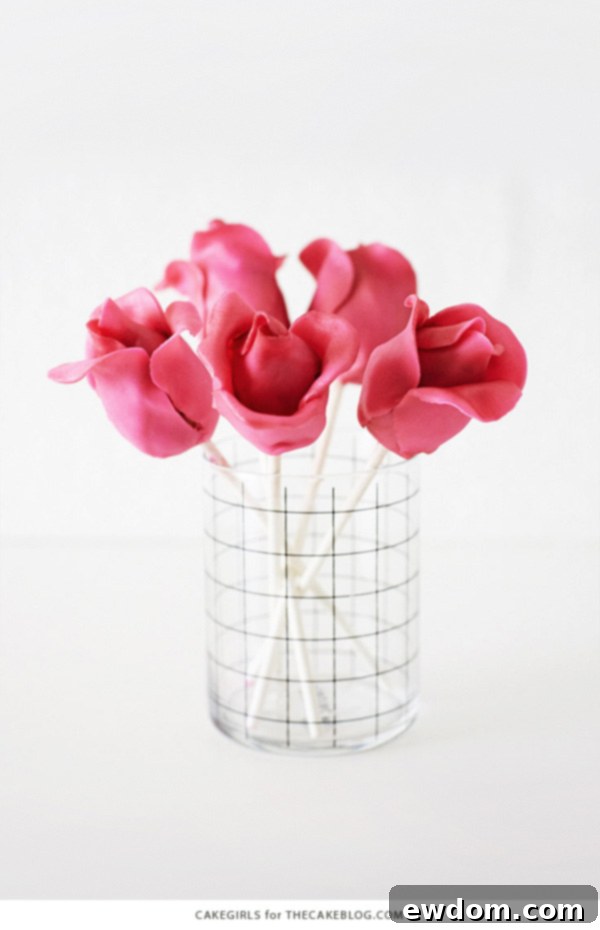 Blossom Cake Pops 4 Tips for making perfect rose cake pops: Use a firm cake pop filling, chill bases well, and roll fondant very thinly for best results.