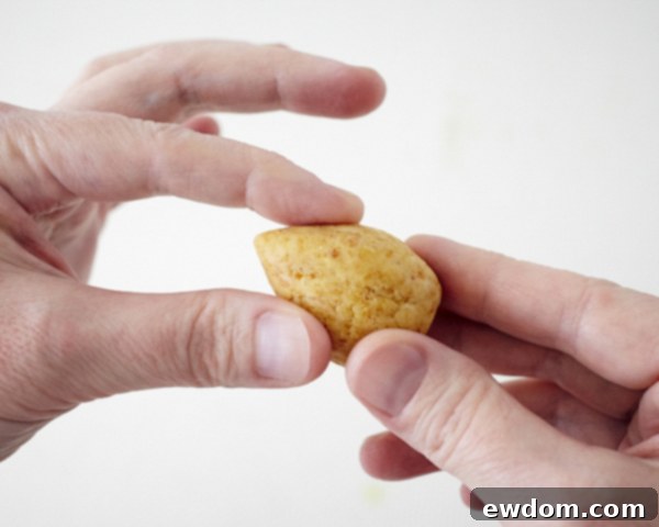 Blossom Cake Pops 7 Teardrop shaped cake pop bases chilling on a tray, ready for the next step.