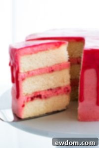 Pink Champagne Raspberry Dream 6 Thumbnail image of the exquisite Raspberry Champagne Cake, glistening with a pink glaze and fresh berries.