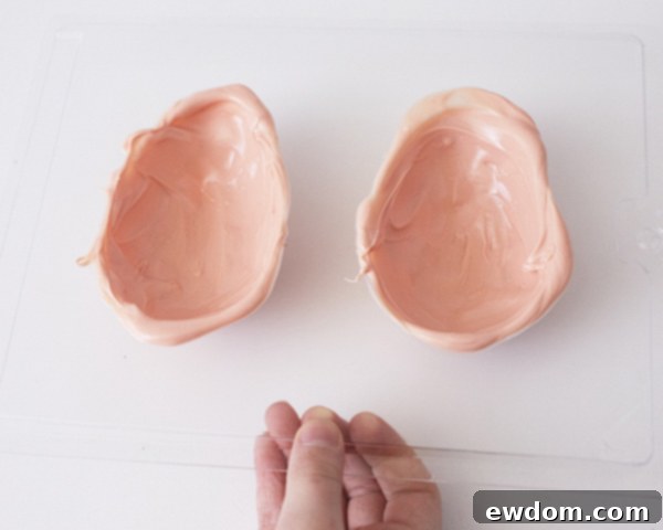 Step 5: Scraping excess coating from the mold to create a flat edge for joining.